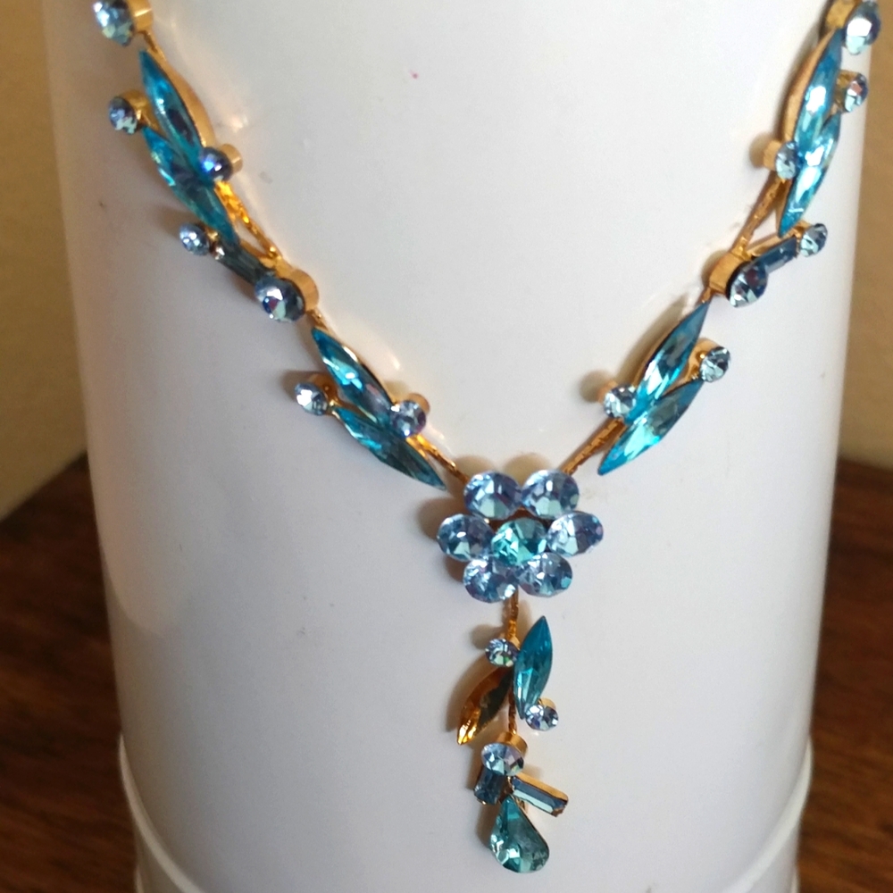 Goldtone dangle necklace with blue stones